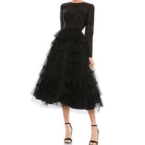 Black tulle midi dress. Long sleeved. Perfect for a holiday party or event.